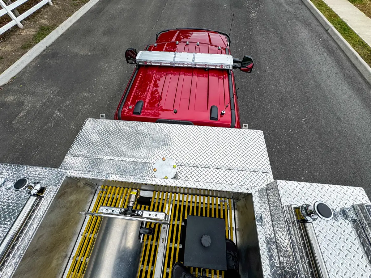Top rear control-panel close-up with valves and fittings on treadplate.
